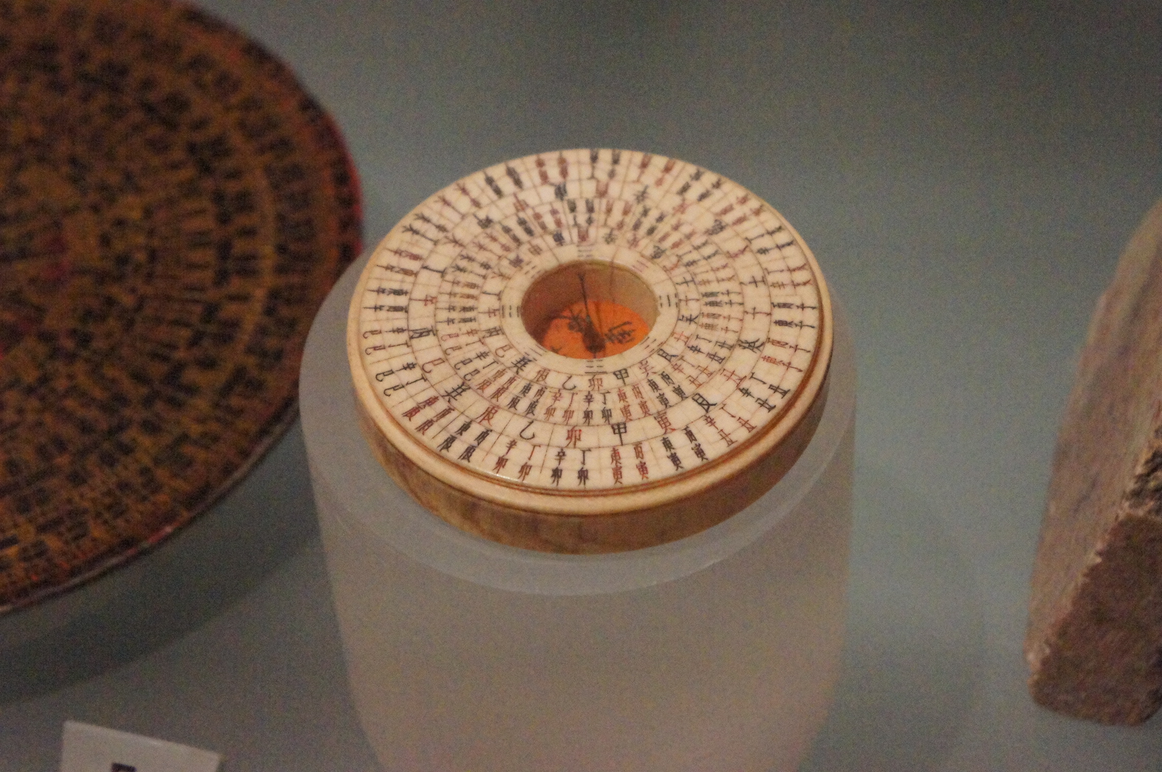 An antique Chinese geomantic compass (luopan) from around 1760, its ivory rings covered in heavenly stems and earthly branches