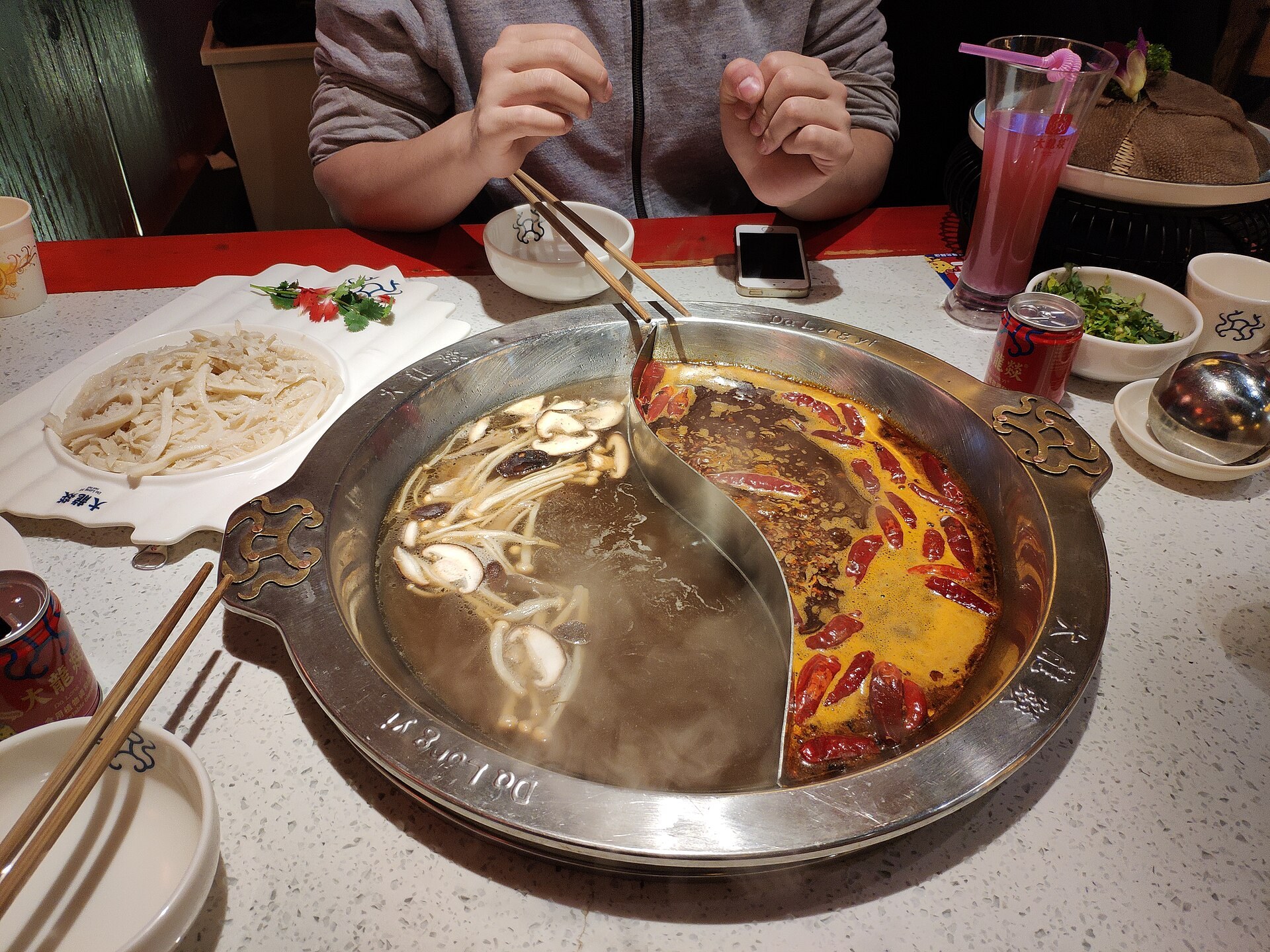 A bubbling split yuanyang hotpot in Chengdu, mala broth on one side