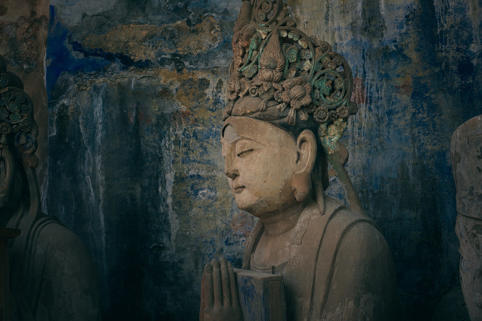 A painted guardian figure carved into the cliff at Baodingshan, part of the Dazu Rock Carvings near Chongqing