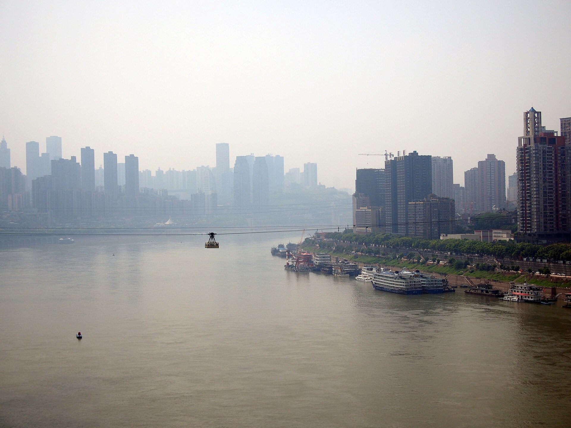A Yangtze River cableway car crosses above the river between Chongqing's two banks