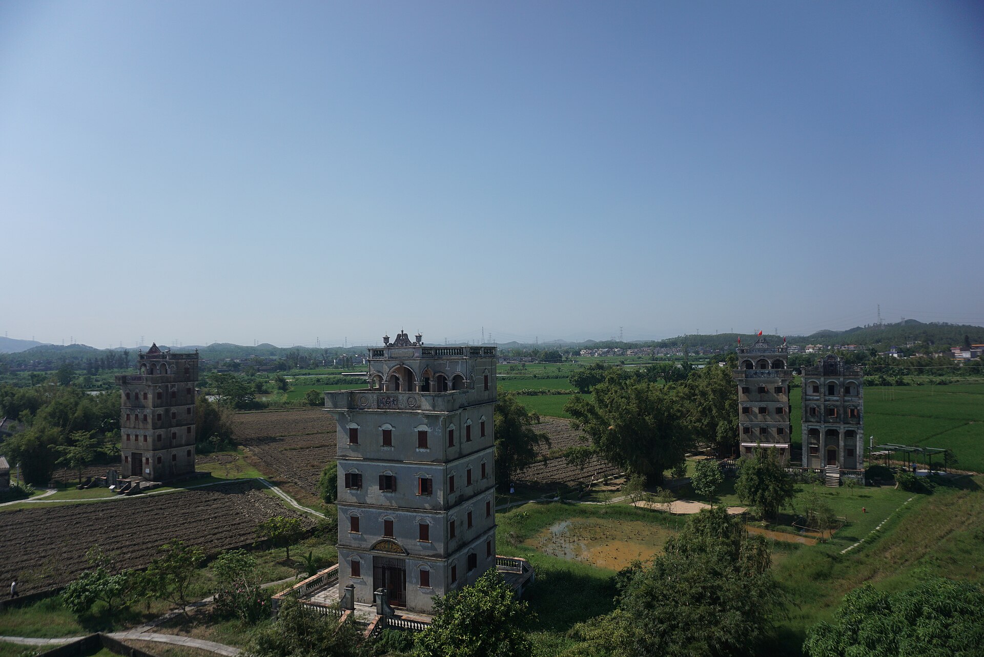 Diaolou watchtower houses rising from farmland and ponds in Zili Village, Kaiping