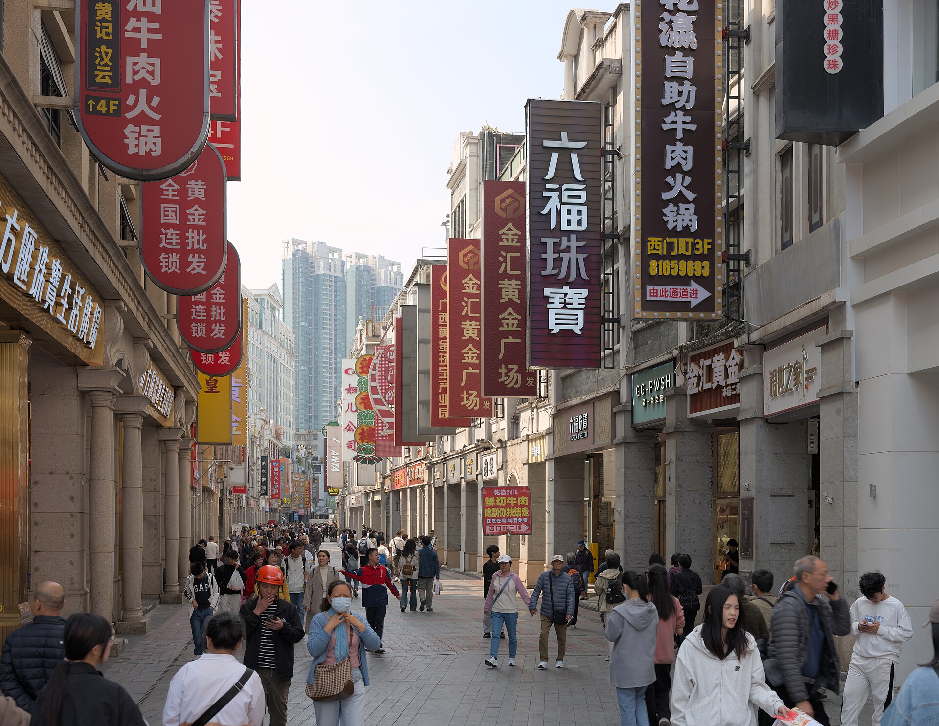 Shoppers walking the arcade-fronted Shangxiajiu pedestrian street in Liwan, Guangzhou's old Xiguan quarter