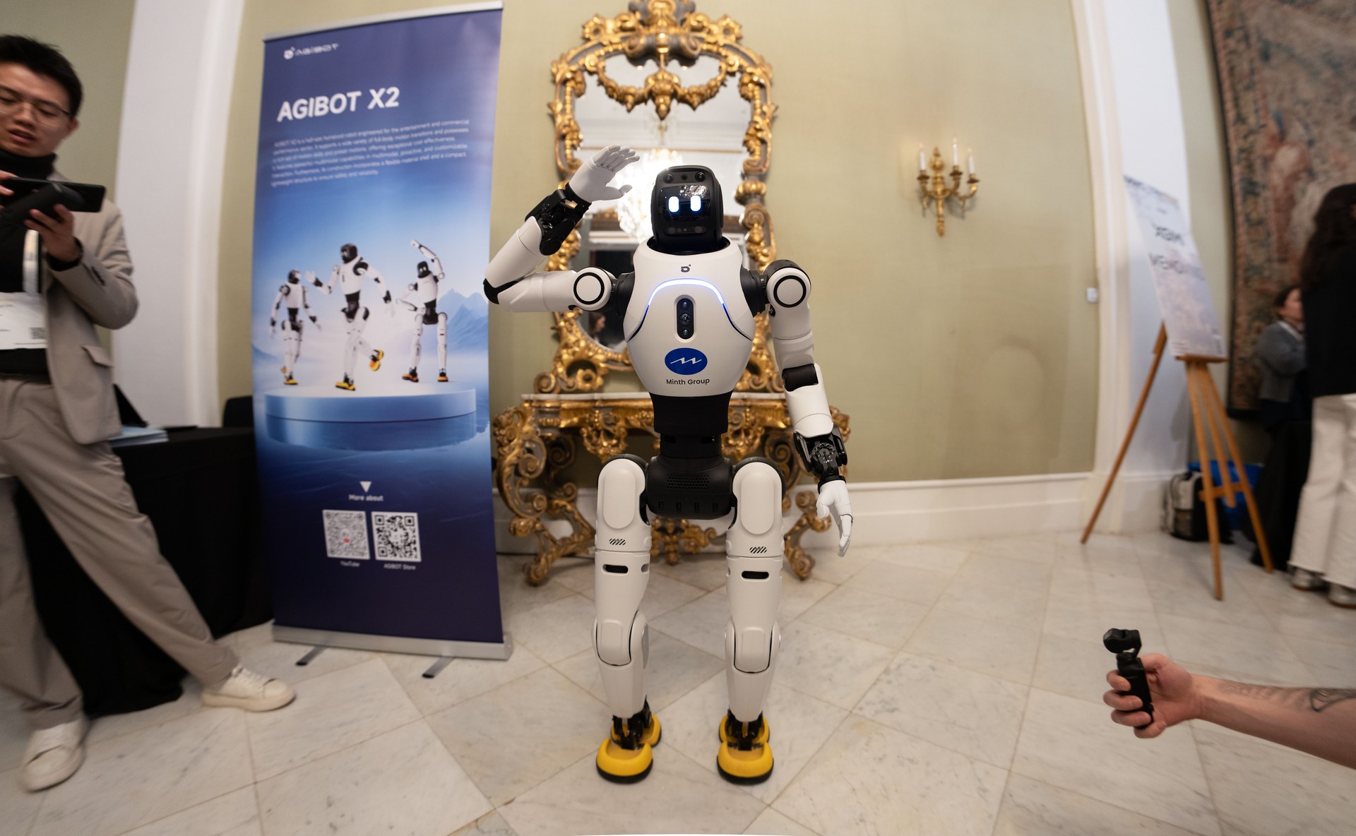 A humanoid robot greeting visitors at a tech exhibition in China