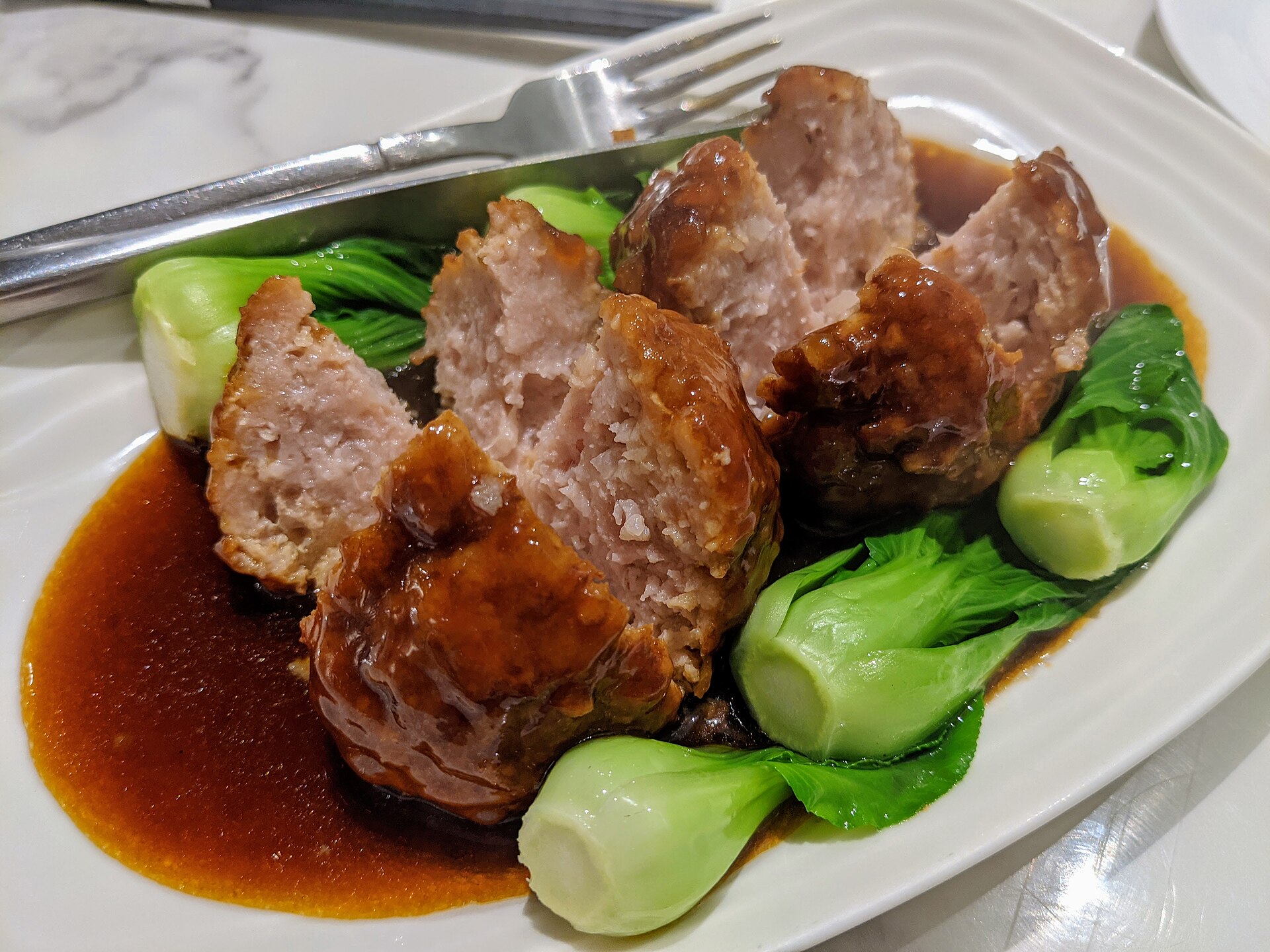 Braised lion’s-head meatballs with bok choy — a banquet staple of the Jiangnan kitchen