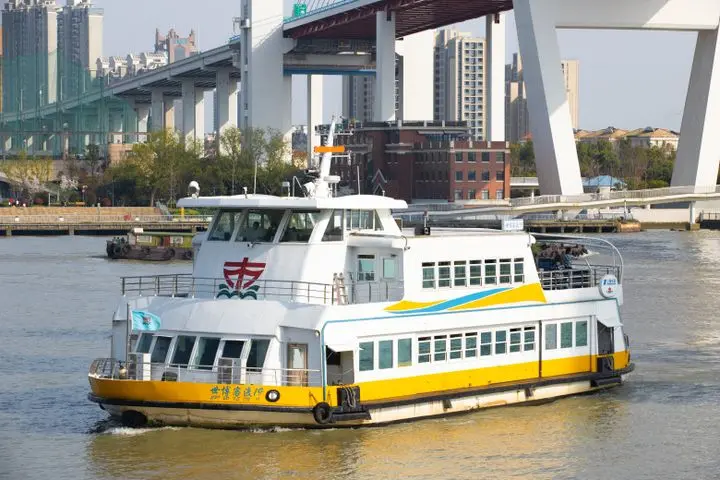 A ferry on the Huangpu River; not the named pier