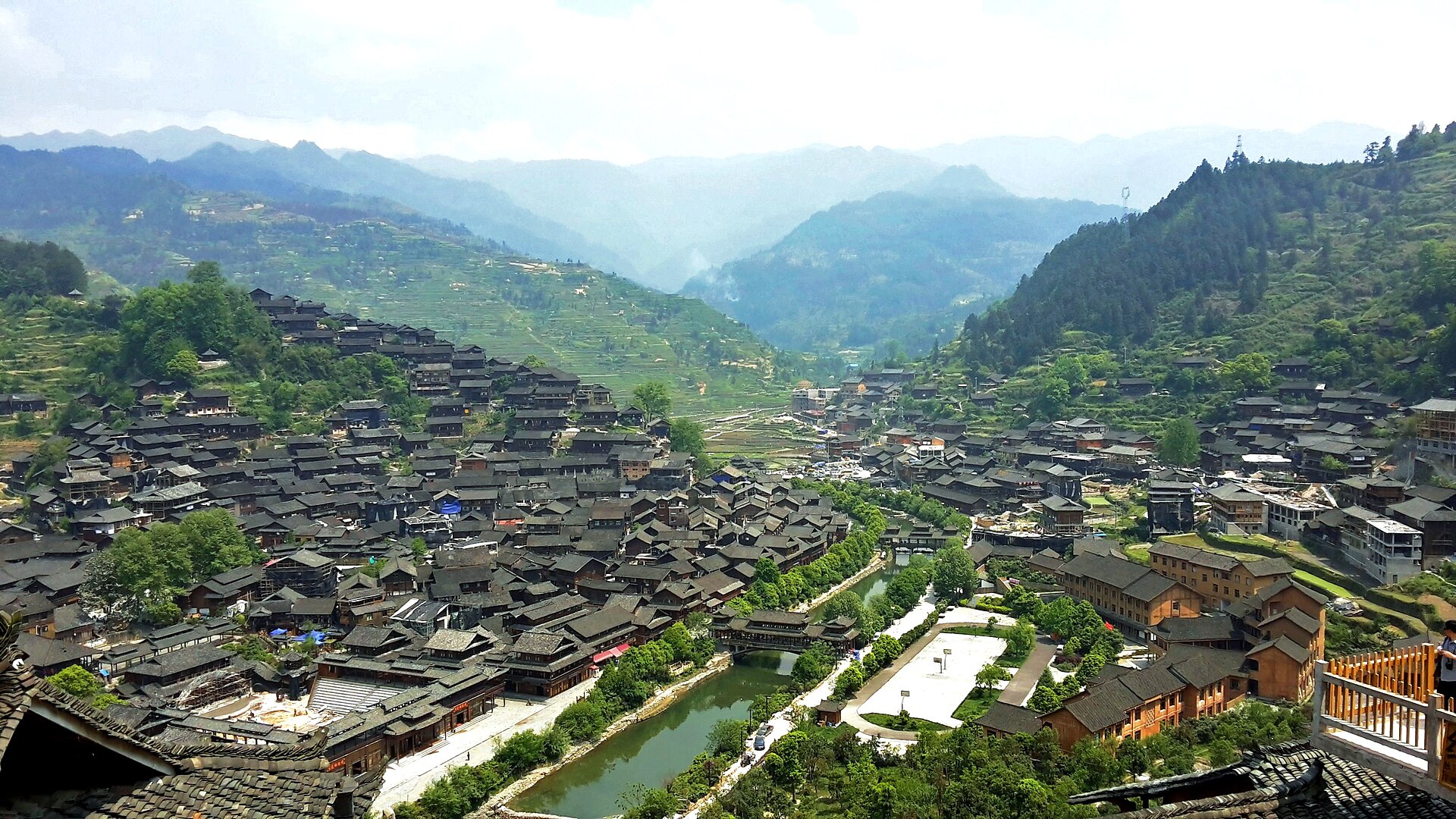 Xijiang Qianhu Miao village spilling across a green Guizhou valley